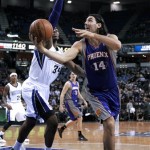 Phoenix Suns forward Luis Scola, of Argentina, right, goes to the basket against Sacramento Kings forward Jason Thompson during the first quarter of an NBA basketball game in Sacramento, Calif., Wednesday, Jan. 23, 2013. (AP Photo/Rich Pedroncelli)