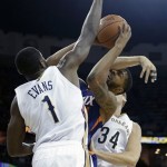 Phoenix Suns power forward Markieff Morris (11) is fouled as he goes to the basket between New Orleans Pelicans point guard Tyreke Evans (1) and center Greg Stiemsma (34) in the first half of an NBA basketball game in New Orleans, Tuesday, Nov. 5, 2013. (AP Photo/Gerald Herbert)
