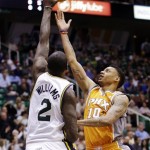 Phoenix Suns' Diante Garrett (10) lays the ball up as Utah Jazz's Marvin Williams (2) defends in the second quarter during an NBA basketball game, Wednesday, March 27, 2013, in Salt Lake City. (AP Photo/Rick Bowmer)