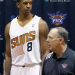 Phoenix Suns' Channing Frye (8) arrives with Lon Babby, Suns team President of Basketball Operations, during the team's NBA basketball media day on Monday, Sept. 30, 2013, in Phoenix. The Suns announced that Frye has been cleared to join the team's training camp, a year after it was found that Frye would have to miss the entire basketball season because of an enlarged heart. (AP Photo/Ross D. Franklin)