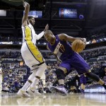 Phoenix Suns forward P.J. Tucker, right, drives against Indiana Pacers forward Paul George in the first half of an NBA basketball game in Indianapolis, Thursday, Jan. 30, 2014. (AP Photo)