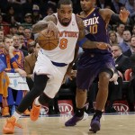 New York Knicks' J.R. Smith (8) drives past Phoenix Suns' Leandro Barbosa (10), of Brazil, during the first half of an NBA basketball game, Monday, Jan. 13, 2014, in New York. (AP Photo/Frank Franklin II)
