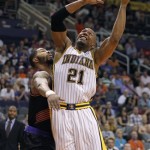 Indiana Pacers forward David West (21) attempts a basket as he is guarded by Phoenix Suns forward Markieff Morris, left, during the first half of an NBA basketball game, Saturday, March 30, 21013, in Phoenix. (AP Photo/Paul Connors)
