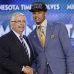 NBA Commissioner David Stern, left, shakes hands with Michigan's Trey Burke, who was selected by the Sacramento Kings in the first round of the NBA basketball draft, Thursday, June 27, 2013, in New York. (AP Photo/Kathy Willens)