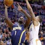  Indiana Pacers' Lance Stephenson (1) goes up for a shot against Phoenix Suns' Markieff Morris (11) during the first half of an NBA basketball game Wednesday, Jan. 22, 2014, in Phoenix. (AP Photo/Ross D. Franklin)