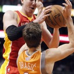 Houston Rockets center Omer Asik, left, of Turkey, battles Phoenix Suns guard Goran Dragic, right, of Slovenia, for a rebound during the second half of an NBA basketball game Saturday, March 9, 2013, in Phoenix. The Suns won 107-105.(AP Photo/Paul Connors)
