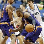  Phoenix Suns' Channing Frye, left, sets a pick on Minnesota Timberwolves' Alexey Shved, right, of Russia, as Leandro Barbosa, of Brazil, drives by in the first quarter of an NBA basketball game on Wednesday, Jan. 8, 2014, in Minneapolis. (AP Photo/Jim Mone)