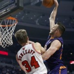 Phoenix Suns center Miles Plumlee, right, dunks over Chicago Bulls forward Mike Dunleavy during the first half of an Phoenix Suns center Miles Plumlee, right, dunks over Chicago Bulls forward Mike Dunleavy during the first half of an NBA basketball game, Tuesday, Jan. 7, 2014, in Chicago. (AP Photo/Charles Rex Arbogast)NBA basketball game, Tuesday, Jan. 7, 2014, in Chicago. (AP Photo/Charles Rex Arbogast)
