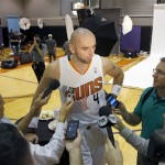 Phoenix Suns' Marcin Gortat (4), of Poland, speaks with reporters during the team's NBA basketball media day on Monday, Sept. 30, 2013, in Phoenix. (AP Photo/Ross D. Franklin)
