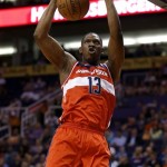 Washington Wizards' Kevin Seraphin (13) dunks against the Phoenix Suns during the first half of an NBA basketball game, Wednesday, March 20, 2013, in Phoenix. (AP Photo/Matt York)
