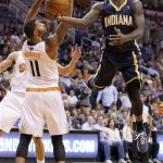  Indiana Pacers' Lance Stephenson, right, tries to get off a shot against Phoenix Suns' Markieff Morris (11) during the first half of an NBA basketball game Wednesday, Jan. 22, 2014, in Phoenix. (AP Photo/Ross D. Franklin)