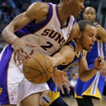 Golden State Warriors' Stephen Curry fouls Phoenix Suns' Wesley Johnson (2) during the second half of an NBA basketball game, Friday, April 5, 2013, in Phoenix. The Warriors won 111-107. (AP Photo/Matt York)