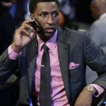 Georgia's Kentavious Caldwell-Pope takes a phone call before the first round of the NBA basketball draft, Thursday, June 27, 2013, in New York. (AP Photo/Kathy Willens)