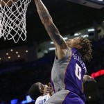 Phoenix Suns forward Michael Beasley (0) dunks in front of Oklahoma City Thunder center Kendrick Perkins during the second quarter of an NBA basketball game in Oklahoma City, Friday, Feb. 8, 2013. (AP Photo/Sue Ogrocki)