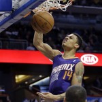 Phoenix Suns' Gerald Green (14) dunks the ball in front of Orlando Magic's Jameer Nelson during the first half of an NBA basketball game in Orlando, Fla., Sunday, Nov. 24, 2013. (AP Photo/John Raoux)