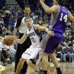 Minnesota Timberwolves' Luke Ridnour, left, works his way around Phoenix Suns' Luis Scola, of Argentina, in the first quarter of an NBA basketball game on Saturday, April 13, 2013, in Minneapolis. (AP Photo/Jim Mone)