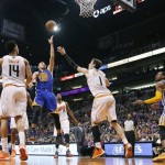  Golden State Warriors' Stephen Curry (30) drives past Phoenix Suns' P.J. Tucker, left, Gerald Green (14), Marcus Morris (15), and Goran Dragic (1), of Slovenia, as Warriors' Andre Iguodala (9) stands near during the first half of an NBA basketball game Saturday, Feb. 8, 2014, in Phoenix. (AP Photo/Ross D. Franklin)