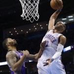 Oklahoma City Thunder guard Russell Westbrook (0) goes up for a dunk in front of Phoenix Suns forward Markeiff Morris (11) in the third quarter of an NBA basketball game in Oklahoma City, Friday, Feb. 8, 2013. Oklahoma City won 127-96. (AP Photo/Sue Ogrocki)