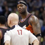 Phoenix Suns center Jermaine O'Neal, right, questions referee Joe Crawford, left, after Crawford called a technical foul on O'Neal against the Boston Celtics in the second half of an NBA basketball game Friday, Feb. 22, 2013, in Phoenix. The Celtics won 113-88. (AP Photo/Paul Connors)