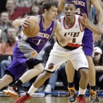 Phoenix Suns guard Goran Dragic, left, from Slovenia, drives on Portland Trail Blazers guard Damian Lillard during the second half of an NBA basketball game in Portland, Ore., Tuesday, Feb. 19, 2013. Dragic scored 16 points and dished out 18 assists as the Suns beat the Trail Blazers 102-98.(AP Photo/Don Ryan)