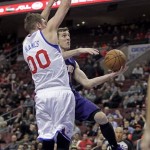 Phoenix Suns' Goran Dragic, left goes up for a shot as Philadelphia 76ers' Spencer Hawes (00) defends in the first half of an NBA basketball game, Monday, Jan. 27, 2014 in Philadelphia. (AP Photo/H. Rumph Jr.)