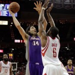 Phoenix Suns forward Luis Scola (14) shoots over Houston Rockets forward Terrence Jones (6) during the first half of an NBA basketball game Tuesday, April 9, 2013, in Houston. (AP Photo/Bob Levey)