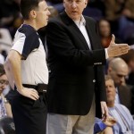 San Antonio Spurs coach Gregg Popovich talks with referee Pat Fraher during the first half of an NBA basketball game against the Phoenix Suns, Sunday, Feb. 24, 2013, in Phoenix. (AP Photo/Matt York)