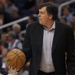 Houston Rockets coach Kevin McHale grabs the ball as he calls a time out against the Phoenix Suns during the first half of an NBA basketball game on Saturday, March 9, 2013, in Phoenix.(AP Photo/Paul Connors)
