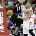Houston Rockets' Chandler Parsons (25) knocks the ball away from Phoenix Suns' Markieff Morris (11) during the third quarter of an NBA basketball game Wednesday, March 13, 2013, in Houston. (AP Photo/David J. Phillip)