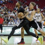 Phoenix Suns' Marcus Morris, left, is fouled by Portland Trail Blazers Meyers Leonard while driving to the basket in the third quarter of an NBA Summer League basketball game, Saturday, July 13, 2013, in Las Vegas. (AP Photo/Julie Jacobson)
