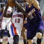 Detroit Pistons guard Will Bynum (12) drives to the basket against Phoenix Suns guard Goran Dragic (1) during the second half of an NBA basketball game, Saturday, Jan. 11, 2014, in Auburn Hills, Mich. The Pistons defeated the Suns 110-108. (AP Photo/Duane Burleson)