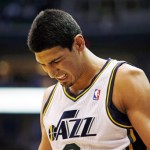 Utah Jazz's Enes Kanter reacts after dislocating his left shoulder during the first half of an NBA basketball game against the Phoenix Suns, Wednesday, March 27, 2013, in Salt Lake City. (AP Photo/The Salt Lake Tribune, Steve Griffin)
