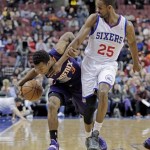Phoenix Suns' Ish Smith (3) drives the ball up court as Philadelphia 76ers' Elliot Williams (25) defends in the first half of an NBA basketball game, Monday, Jan. 27, 2014 in Philadelphia. (AP Photo/H. Rumph Jr.)