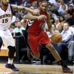 
Toronto Raptors' Alan Anderson (6) drives against Phoenix Suns' Marcus Morris (15) during the first half of an NBA basketball game, Wednesday, March 6, 2013, in Phoenix. (AP Photo/Matt York)
