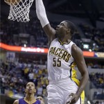Indiana Pacers center Roy Hibbert (55) dunks in front of Phoenix Suns forward Channing Frye in the second half of an NBA basketball game in Indianapolis, Thursday, Jan. 30, 2014. The Suns defeated the Pacers 102-94. (AP Photo)