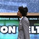 Lucas Nogueira, of Brazil, leaves the stage after being selected by the Boston Celtics in the first round of the NBA basketball draft, Thursday, June 27, 2013, in New York. (AP Photo/Kathy Willens)