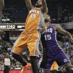 Phoenix Suns forward Marcus Morris shoots in front of Sacramento Kings center DeMarcus Cousins during the first quarter of an NBA basketball game in Sacramento, Calif., Friday, March 8, 2013. (AP Photo/Rich Pedroncelli)