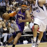 Phoenix Suns guard Jared Dudley (3) drives against Dallas Mavericks forward Dirk Nowitzki (41), of Germany, during the first half of an NBA basketball game, Wednesday, April 10, 2013, in Dallas. (AP Photo/LM Otero)