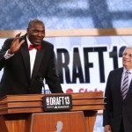 Retired NBA star Hakeem Olajuwan, left, pays tribute to NBA Commissioner David Stern at the end of the first round of the NBA basketball draft, Thursday, June 27, 2013, in New York. Stern is retiring in February. (AP Photo/Jason DeCrow)
