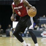Miami Heat forward James Ennis sets the offense against the Phoenix Suns in the third quarter of an NBA Summer League basketball game on Sunday, July 21, 2013, in Las Vegas. (AP Photo/Julie Jacobson)