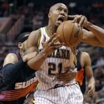 Indiana Pacers forward David West, right, is fouled by Phoenix Suns forward Jared Dudley, left, during the second half of an NBA basketball game Saturday, March 30, 2013, in Phoenix. The Pacers won 112-104. (AP Photo/Paul Connors)