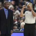 Official Marc Davis, right, explains a call to Phoenix Suns interim head coach Lindsey Hunter, during the first quarter of an NBA basketball game against the Sacramento Kings in Sacramento, Calif., Wednesday, Jan. 23, 2013. Hunter is coaching his first game since replacing Alvin Gentry. (AP Photo/Rich Pedroncelli)