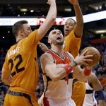  Washington Wizards' Marcin Gortat (4) goes to the basket as he is blocked by Phoenix Suns' Miles Plumlee (22) and Channing Frye during the first half of an NBA basketball game, Friday, Jan. 24, 2014, in Phoenix. (AP Photo/Ross D. Franklin)