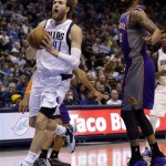 Dallas Mavericks forward Dirk Nowitzki (41), of Germany, drives past Phoenix Suns forward Markieff Morris (11) during the first half of an NBA basketball game, Wednesday, April 10, 2013, in Dallas. (AP Photo/LM Otero)