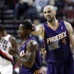 Phoenix Suns center Marcin Gortat, right, pats teammate Eric Bledsoe on the head after Bledsoe fed him the pass for a score during the second half of an NBA preseason basketball game against the Portland Trail Blazers in Portland, Ore., Wednesday, Oct. 9, 2013. Gortat scored eight points as the Suns won 104-98. (AP Photo/Don Ryan)