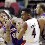 Portland Trail Blazers guard Nolan Smith (4) is double-teamed by Phoenix Suns' Michael Beasley, left, and Kendall Marshall during the first half of an NBA basketball game in Portland, Ore., Tuesday, Feb. 19, 2013. (AP Photo/Don Ryan)
