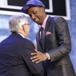 NBA Commissioner David Stern, left, shakes hands with Georgia's Kentavious Caldwell-Pope, who was selected by the Sacramento Kings in the first round of the NBA basketball draft, Thursday, June 27, 2013, in New York. (AP Photo/Kathy Willens)