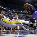 Indiana Pacers forward Paul George, left, draws the charge from Phoenix Suns forward P.J. Tucker in the first half of an NBA basketball game in Indianapolis, Thursday, Jan. 30, 2014. (AP Photo)