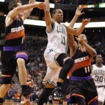 Boston Celtics guard Courtney Lee, center, drives between Phoenix Suns guard Goran Dragic, left, of Slovenia, and forward Markieff Morris, right, in the first half of an NBA basketball game, Friday, Feb. 22, 2013, in Phoenix. (AP Photo/Paul Connors)