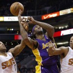  Los Angeles Lakers' Jordan Hill, middle, loses the ball as Phoenix Suns' P.J. Tucker, left, tips it away while Suns' Channing Frye (8) defends during the first half of an NBA basketball game Wednesday, Jan. 15, 2014, in Phoenix. (AP Photo/Ross D. Franklin)
